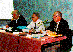 J. Crease Treasurer, President D. Abir, and G. H. Wood Secretary General manage the General Assembly in Chambry.